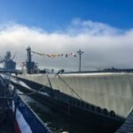 gray ship beside dock
